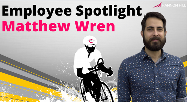 The image is an employee spotlight promotional banner featuring a man named Matthew Wren alongside a stylized graphic of a cyclist, with the Hannon Hill company logo in the corner.